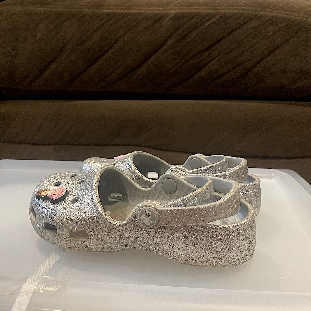 Silver sparkly crocs with princess jibbitz